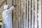 Worker spraying closed cell spray foam insulation on a home