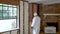 Worker spraying closed cell spray foam insulation on a home wall