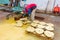 Worker are stacking cut wooden rings for decor on a pallet