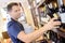 Worker stacking wine on to shelf