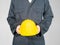 Worker standing in blue coverall holding hardhat