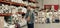 Worker standing with an inventory clipboard on a warehouse floor