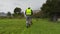 Worker starting cut the grass in rainy day