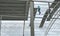 Worker on steel structure thatch the roof.