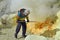 Worker at sulphur mine. Kawah Ijen crater