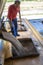 Worker supervises the loading of a truck with sorghum seed