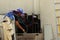 Worker sweeps debris in air conditioner