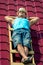 A worker takes a sun bath on the roof of the house