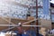 A worker throws bricks at another worker, construction work in a private area, wooden scaffolding near the walls