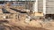 A worker transfers elements for the installation of the formwork at the construction site. Monolithic concrete formwork during the