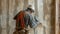 A worker uses a drywall sander to smooth out imperfections in preparation for painting the interior walls