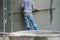 Worker uses the trowel for plastering the brickwork wall by mixed cement