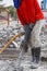 Worker using construction drilling cement on the ground