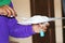 Worker using plaster gypsum on putty knife at ceiling