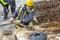 Worker using rebar bend machine