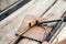 Worker using steel wire and pincers to bend steel bars, preparing for concrete pouring on construction site