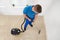 Worker Vacuuming Carpet