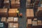 A worker in a warehouse uses a hand pallet stacker to transport pallets. Generative AI