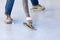 Worker Wearing Spiked Shoes Smoothing Wet Pool Plaster With Trowel