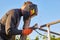 Worker welder working welding steel in industry with safety mask