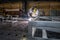 Worker welds aluminum parts. Metalworking plant, the wizard in the mask