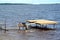 The worker welds metal designs of a pier in the Rybinsk reservoir. Yaroslavl region