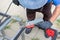 worker welds the steel structure at the construction site