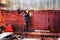 Worker welds the wall of steel fuel tank