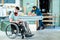 Worker in wheelchair in a carpenter`s workshop with his colleagu