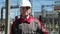 Worker in white hard hat at electric power station