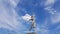 Worker woman historical monument on blue sky with white clouds background. Social realism sculpture in Odessa region of Ukraine