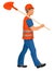 A worker in work clothes walks with a shovel on his shoulder