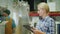 Worker working with a tablet on the background of the conveyor in the background. Beverage Industry