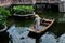 Worker is working on wood boat