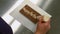 Worker writing happy birthday on a chocolate plaque