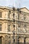 Workers assemble scaffolding near the Louvre, Paris