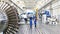 Workers assembling and constructing gas turbines in a modern ind