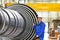 Workers assembling and constructing gas turbines in a modern ind