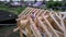 Workers are building on frame roof of wooden house. Clip. Top view of workers building roof frame of wooden country