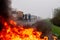 Workers burn tires in front of a factory during a protest in Firmat
