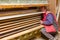 Workers in carpentry placed glued wooden profiles in the large clamp machine for pressing