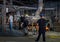 Workers carry melted glass in a factory