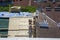 Workers carry out repair work on the roof of the building