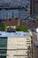 Workers carry out repair work on the roof of the building