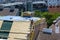 Workers carry out repair work on the roof of the building