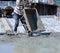 Workers are cementing cement on the floor of reinforced concrete buildings.