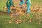 Workers cleaning fallen leaves