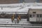Workers clearing frozen snow from railroad track in Manhattan USA.