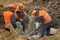 Workers at the construction site chop a jackhammer piles are cut