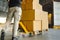 Workers Courier Unloading Packaging Boxes on Pallet into Cargo Container. Shipping Warehouse. Delivery Trucks Shipment Cargo.